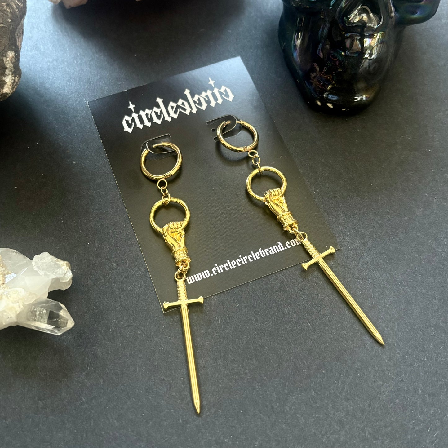 Hand and Sword gold dangle earrings