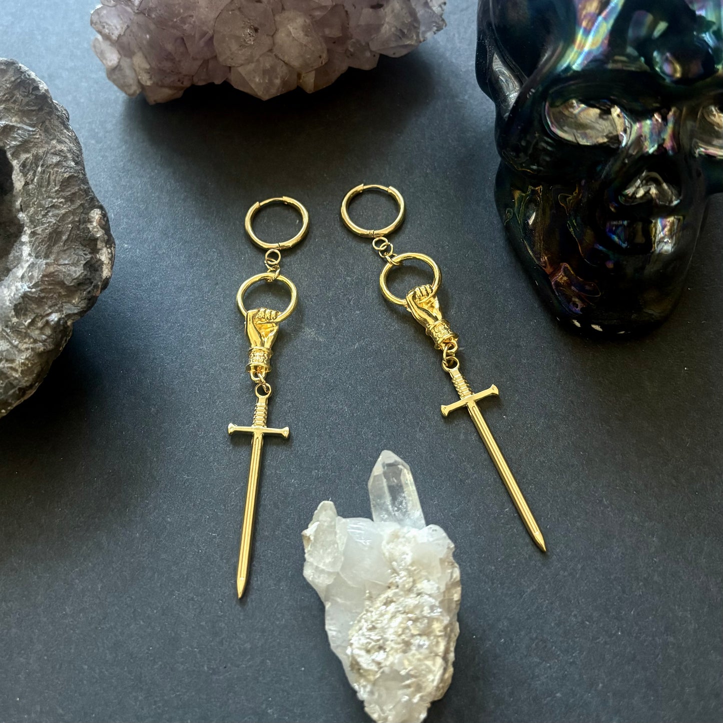 Hand and Sword gold dangle earrings