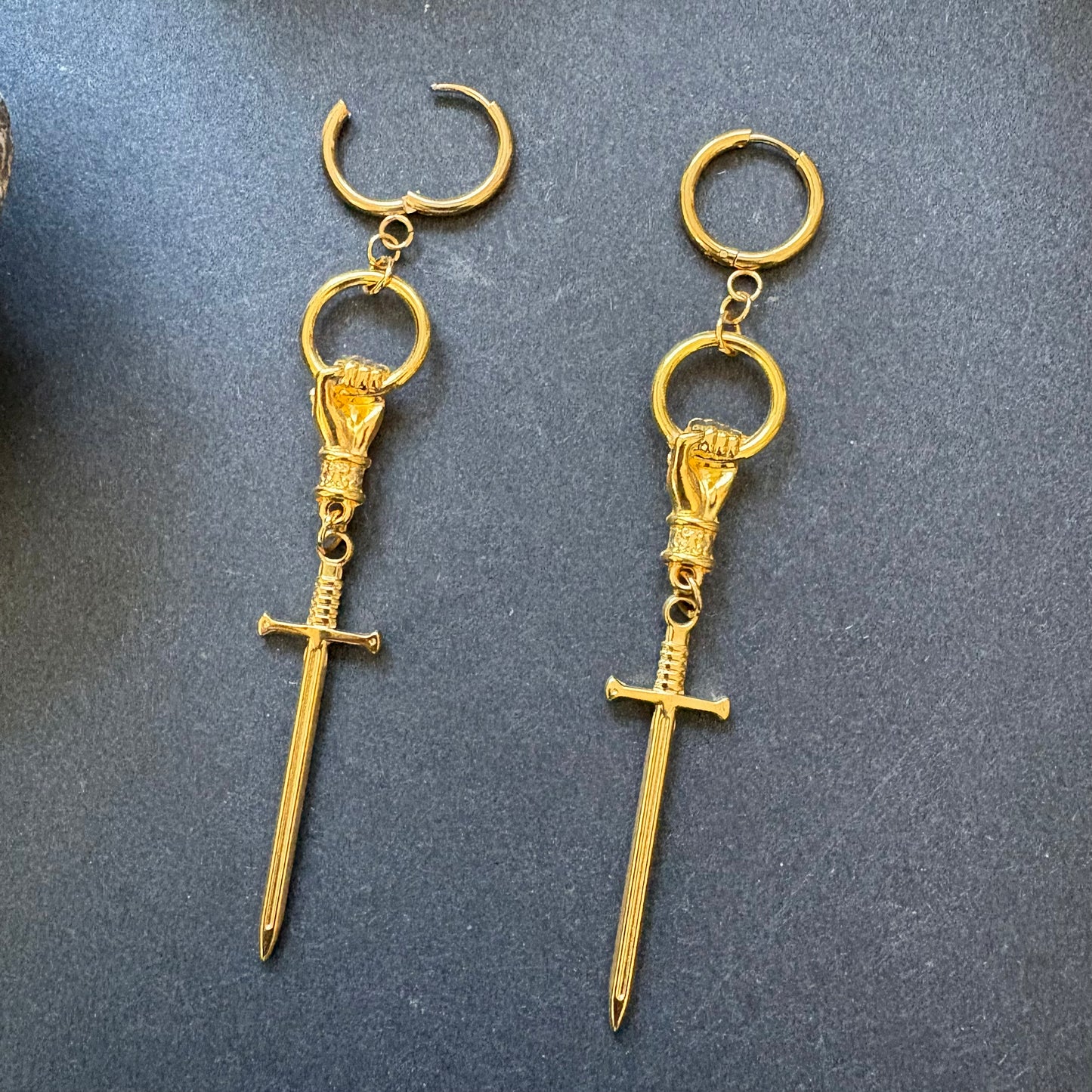 Hand and Sword gold dangle earrings