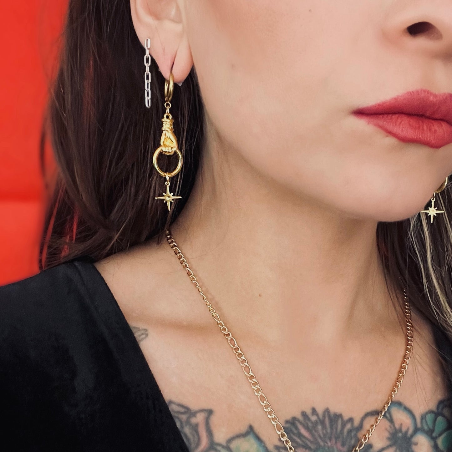 Gold dangly hand and star hoop earrings