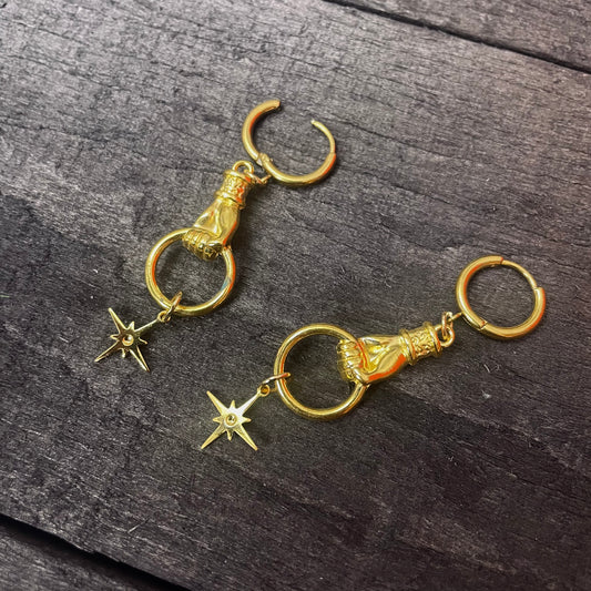 Gold dangly hand and star hoop earrings